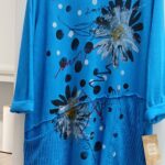 Color trending tunic electric blue bold daisy print patchwork hem USA