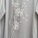 Light Grey Dandelion Notchneck Print Hoodie:, Hi-Low Hem by Marushka print is white.Light fleece super soft.
