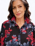 Model wearing Klaveli georgette blouse with red and gray floral pattern made in USA by Italian designer boutique fashion